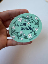 Load image into Gallery viewer, Vintage-inspired vinyl matte sticker with the empowering phrase ‘I Am Worthy’ in an ornate Art Deco design.