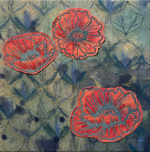 Load image into Gallery viewer, Three red floral poppy patches on a textured green and blue fabric background