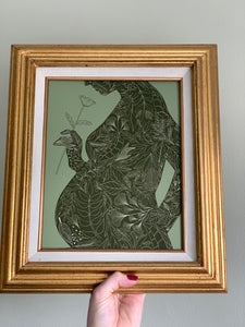 Vintage-inspired pregnancy silhouette art print with botanical accents—perfect for announcing a new baby in an artful, gentle way