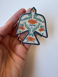 Peaceful dove vinyl matte sticker carrying poppies—symbolizing hope, healing, and remembrance in a vintage folk-art style.
