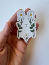 Load image into Gallery viewer, Delicate sticker illustrating a woman’s torso with blooming wildflowers in vintage style—celebrating body positivity and nature’s strength.