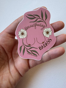 Feminist floral vinyl sticker honoring breastfeeding and motherhood with soft botanicals and empowering mother imagery.