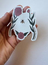 Load image into Gallery viewer, Delicate sticker illustrating a woman’s torso with blooming wildflowers in vintage style—celebrating body positivity and nature’s strength.